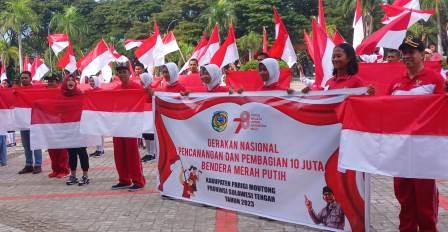 Pemkab Parimo Resmi Laksanakan Gernas Pembagian Bendera Merah Putih